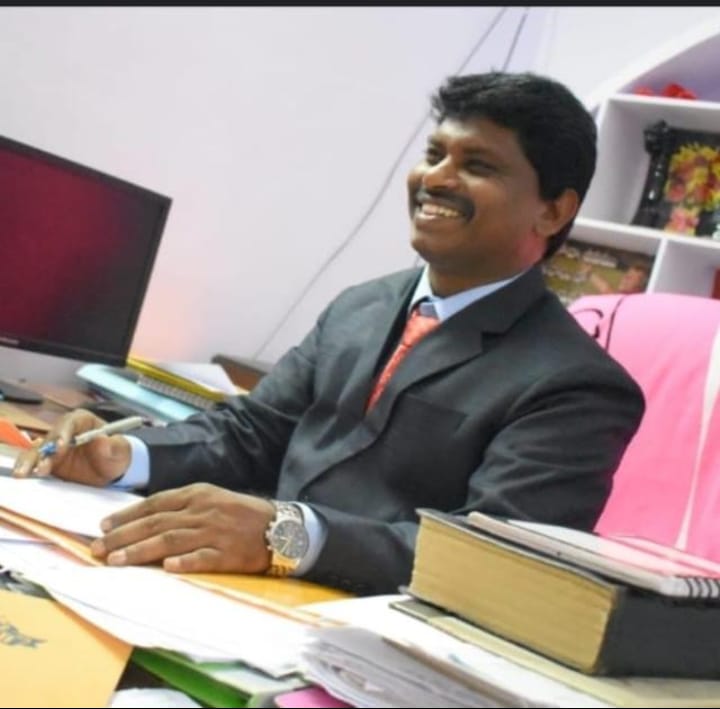 Ganga Chalam Geddam at his desk